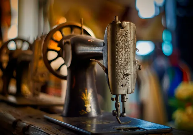 Detailed close-up of a vintage sewing machine, perfect for retro and antique-themed designs.