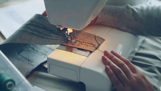 Close-up of a sewing machine stitching fabric, focused on hands and textile.