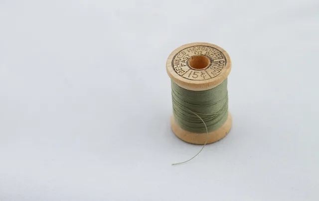 green thread, sew, sewing, wooden spool, thread spool, vintage, antique, sewing antique, old thread, green thread, sewing, sewing, sewing, sewing, sewing. Halifax salt air and the care of vintage sewing machines on the Atlantic coast
