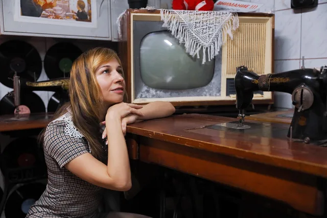 woman, meditate, swap meet, antiques, retro, vintage, collar, fashion, style, 1960, dress, old tv, tube tv, old sewing machine, nostalgia, old things, portrait, ponder, dream, pretty, 60s, old tv, old tv, old tv, old tv, old tv, old things. Vintage is a sales word, not a date, for these sewing machines in 2027